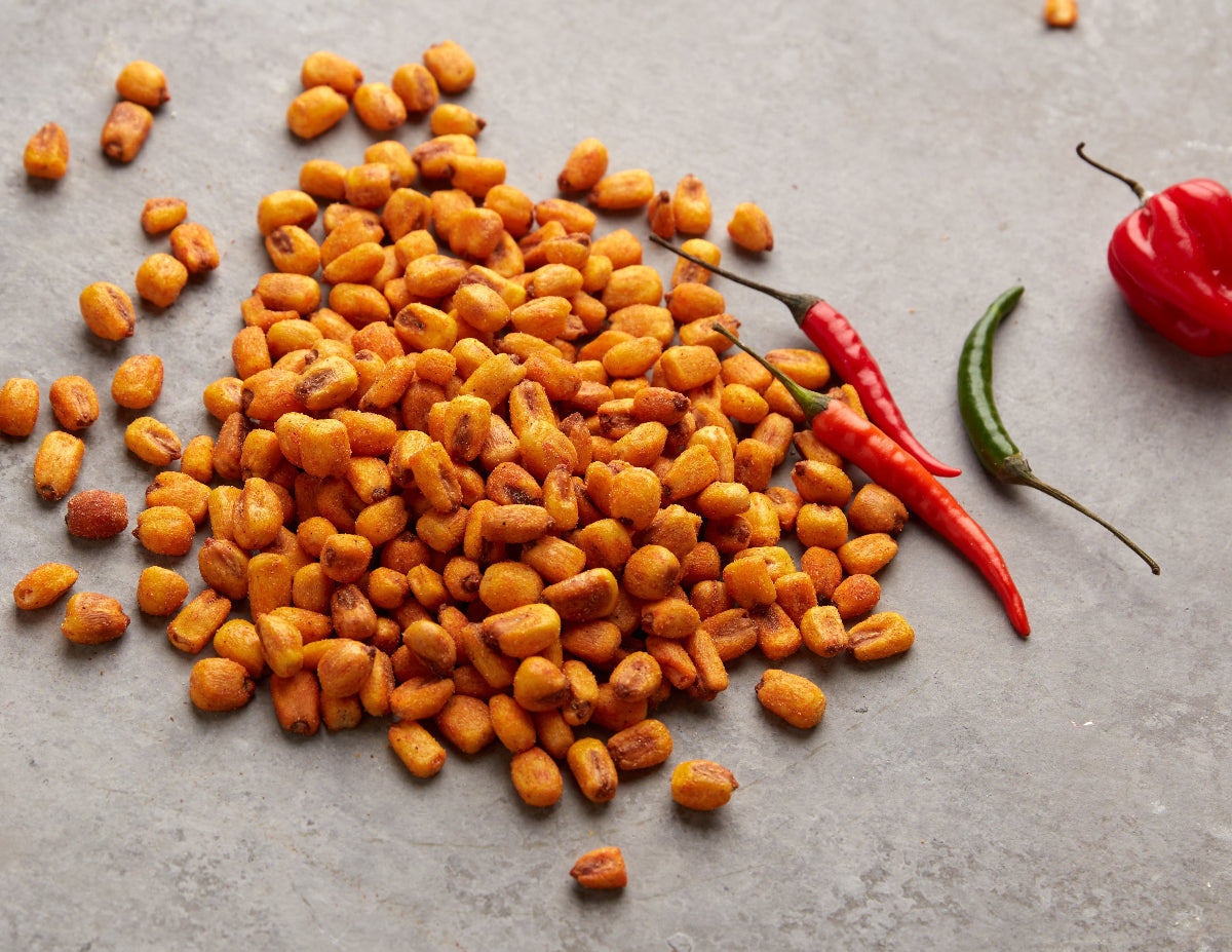Geöffnete NESSLIM Packung mit Chili-Maiskörnern